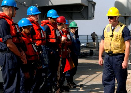 US Navy 090217-N-9134V-017 Boatswain's Mate 3rd Class Zachary Zimmerman gives a safety brief to line handlers