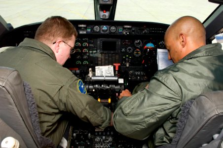 US Navy 090219-N-9552I-030 Naval Aircrewmen 1st Class Troy Rudisill and David Williams conduct pre-flight checks in the cockpit of a Gulfstream C-20A-G III