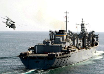 US Navy 090217-N-3392P-032 The Military Sealift Command fast combat support ship USNS Supply (T-AOE 6) conducts a vertical replenishment with the amphibious dock landing ship USS Carter Hall (LSD 50)