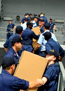 US Navy 090219-N-7280V-044 Sailors unload pallets of medicine, books, and toys to be donated