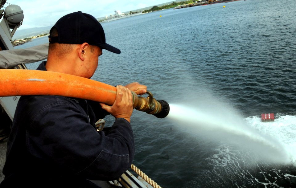 US Navy 090219-N-9758L-157 Damage Controlman 2nd Class Dan Bonoan pushes away an improvised explosive device during an anti-terrorism force protection drill