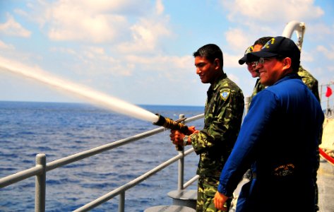 US Navy 090218-N-4774B-028 Members of the Maldives National Defense Force Coast Guard receive training from Sailors aboard USS Lake Champlain (CG 57) photo