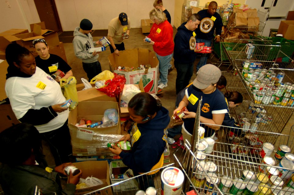 US Navy 090219-N-7544A-076 Sailors sort through food items checking expiration dates while volunteering at The Food Bank of Southeastern Virginia