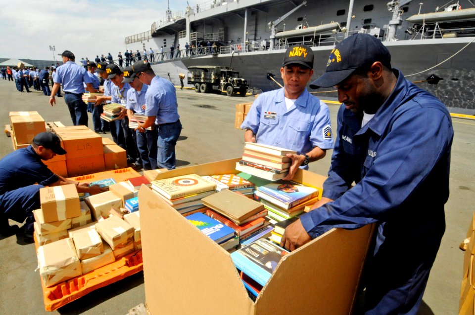 US Navy 090219-N-7280V-135 Armed Forces of the Philippines Navy and Sailors unload pallets of Project Handclasp donated medicine, books, and toys