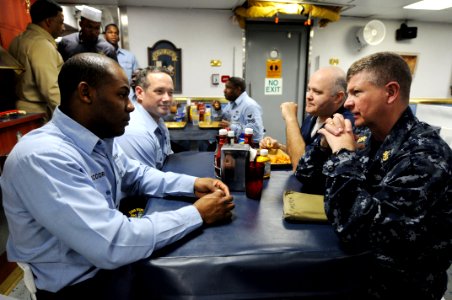 US Navy 090218-N-9818V-244 Master Chief Petty Officer of the Navy (MCPON) Rick West speaks with Sailors on the mess decks aboard the guided-missile frigate USS Simpson (FFG 56) during lunch with the crew