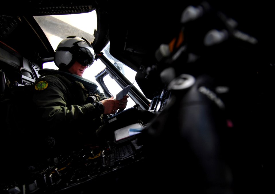 US Navy 090223-N-2984R-024 Cmdr. Malachie Sandie goes over the pre-flight procedures for a plane guard mission