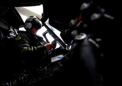 US Navy 090223-N-2984R-024 Cmdr. Malachie Sandie goes over the pre-flight procedures for a plane guard mission