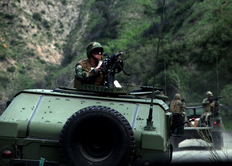 US Navy 090224-N-1424C-767 enior Chief Boatswain's Mate Micheal Garcia mans an M240 machine gun