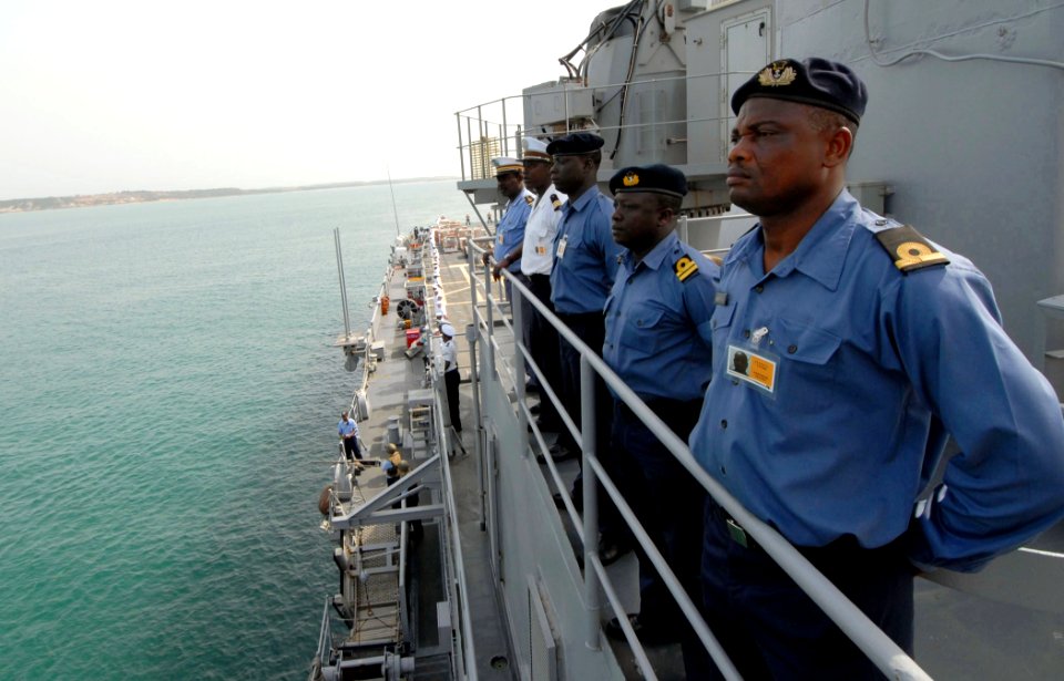 US Navy 090220-N-1688B-007 International partners aboard the amphibious dock ship USS Nashville (LPD 13) man the rails as the ship arrives in Sekondi, Ghana