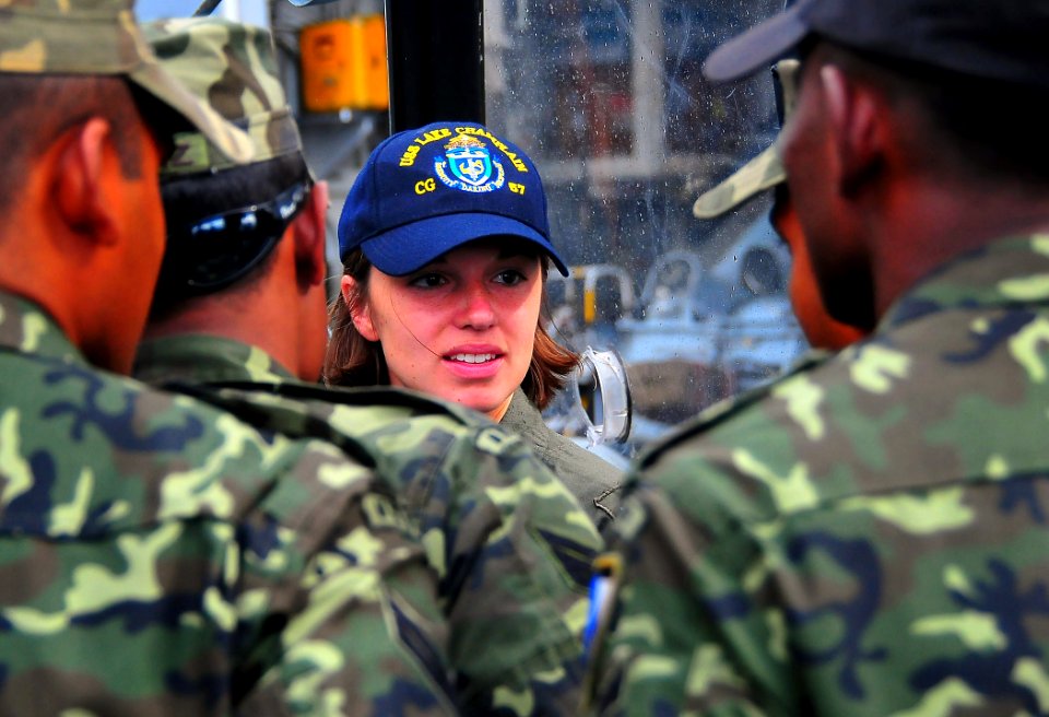 US Navy 090221-N-4774B-020 Lt. j.g. Rebecca Faunt explains the primary functions of helicopters to members of the Maldives National Defense Force Coast Guard