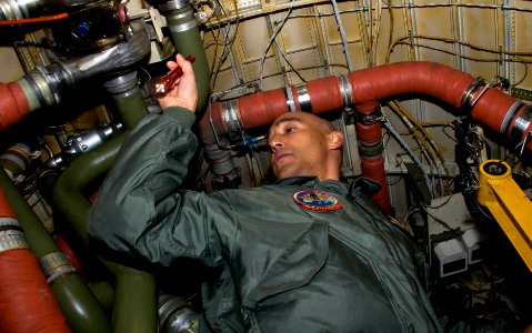 US Navy 090219-N-9552I-013 Naval Aircrewman 1st Class David Williams conducts a pre-flight check in the tail-end of a Gulfstream C-20A-G III