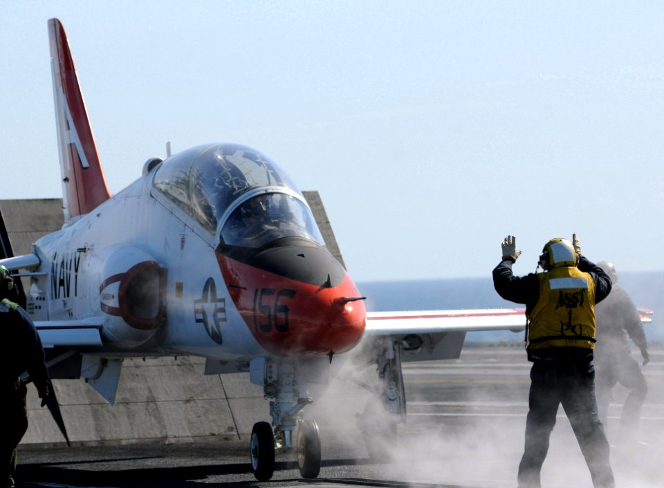 US Navy 090220-N-3610L-621 A handler guides a T-45 Goshawk