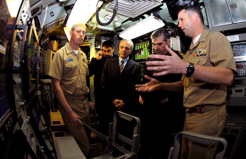 US Navy 090224-N-7705S-046 Cmdr. Tyler Meador, right, describes sonar room operations to Vice Adm. Georgios Karamalikis, Chief of Hellenic (Greek) Navy General Staff