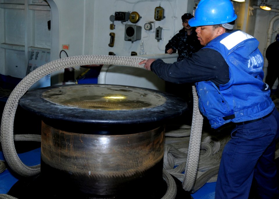 US Navy 090221-N-4014G-046 Boatswain's Mate Seaman Charles Pegues takes a line off of the starboard capstan aboard SS Dwight D. Eisenhower (CVN 69)