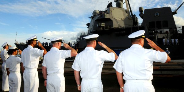 US Navy 090224-N-9758L-039 Officers and chief petty officers assigned to commands in the Oahu region salute during morning colors as the Pearl Harbor-based guided-missile destroyer USS Chafee (DDG 90) departs for a scheduled de