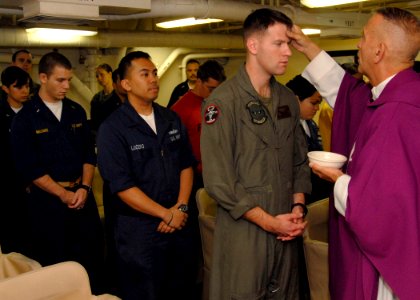 US Navy 090225-N-8283S-018 Sailors and Marines prepare to receive ashes during Ash Wednesday Mass aboard the amphibious assault ship USS Boxer (LHD 4)