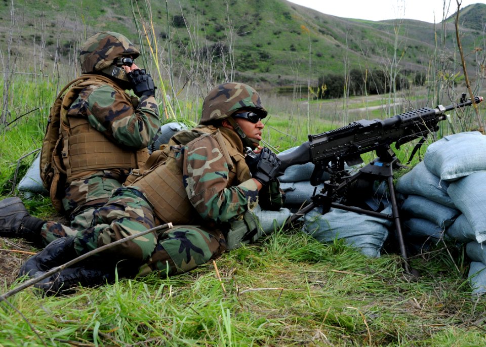 US Navy 090224-N-1424C-804 Lt. Jasmine Gipson mans an M240 machine gun