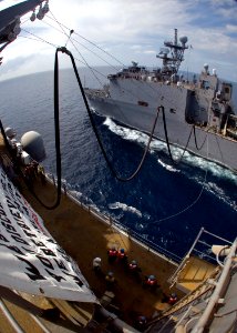 US Navy 090224-N-5253W-006 Sailors aboard the amphibious assault ship USS Essex (LHD 2) tend fuel lines while conducting a simulated refueling at sea with the amphibious dock landing ship USS Harpers Ferry (LSD 49)