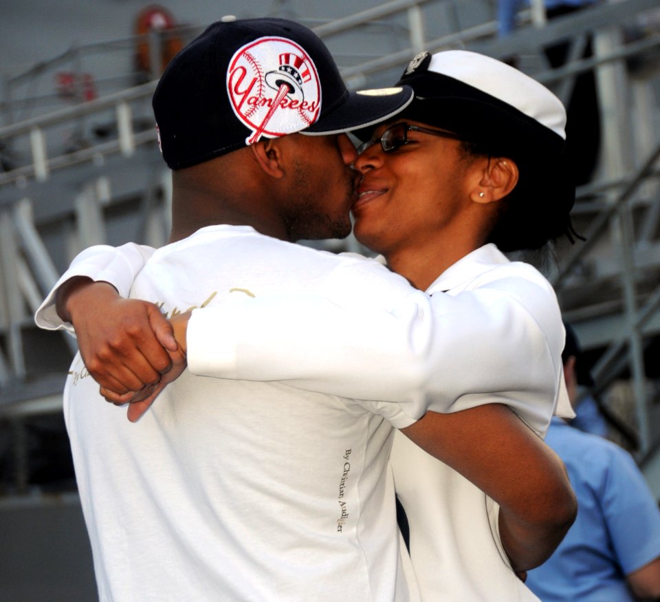 US Navy 090224-N-9758L-007 A Sailor assigned to the guided-missile destroyer USS Chafee (DDG 90) says goodbye to a loved one before departing for a scheduled deployment to the western Pacific Ocean
