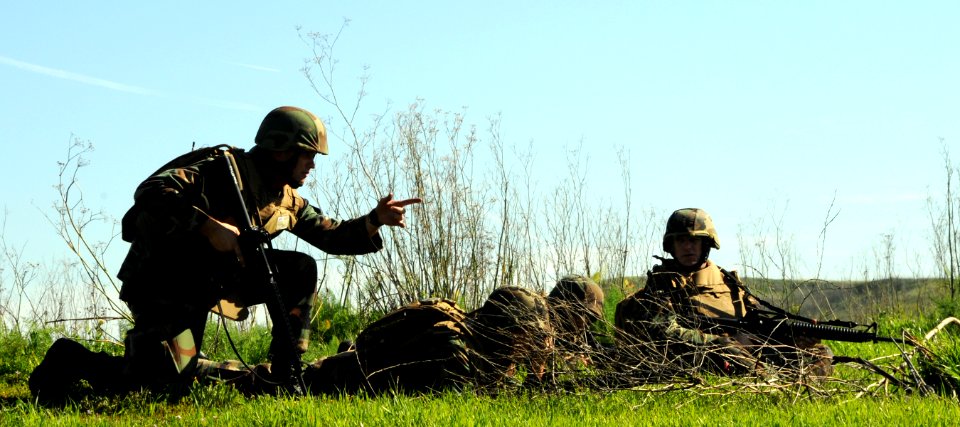 US Navy 090224-N-1424C-707 Officers and chief petty officers take cover as an