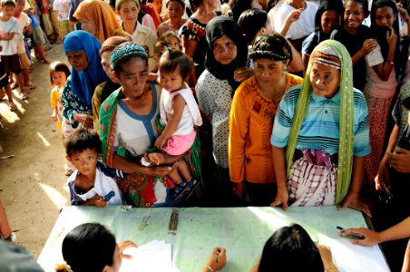 US Navy 090221-N-7130B-013 Residents from Taloksangay Barangay register to receive free medical and dental care from members of the Armed Forces of the Philippines photo