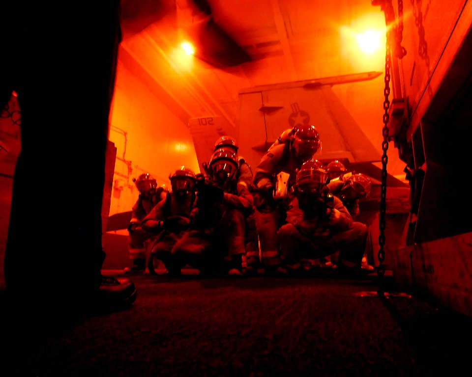 US Navy 090225-N-1226D-084 Sailors battle a simulated class alpha fire aboard USS John C. Stennis (CVN 74)