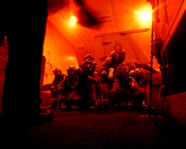 US Navy 090225-N-1226D-084 Sailors battle a simulated class alpha fire aboard USS John C. Stennis (CVN 74) photo