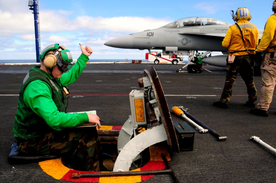 US Navy 090225-N-3946H-049 Aviation Boatswain's Mate (Equipment) 1st Class Jason Slama gives the thumbs-up signal to the catapult safety officer