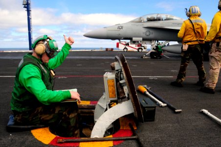 US Navy 090225-N-3946H-049 Aviation Boatswain's Mate (Equipment) 1st Class Jason Slama gives the thumbs-up signal to the catapult safety officer