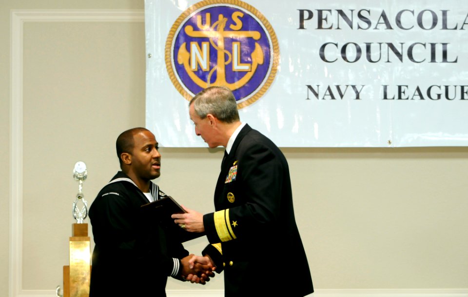 US Navy 090226-N-5328N-355 Rear Adm. Gary R. Jones, Commander, Naval Education and Training Command, congratulates Hospital Corpsman 1st Class Kelvin J. Chatman for winning the Pensacola Council of the Navy League of the United