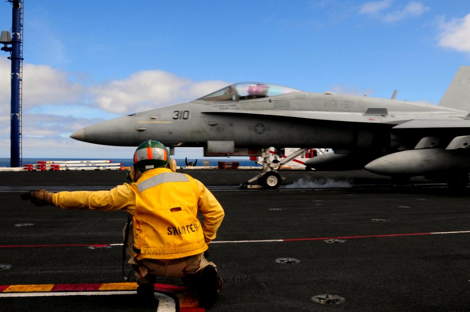 US Navy 090225-N-3946H-028 Lt. Lee Zaltsman gives the signal to launch to an F-A-18F Super Hornet