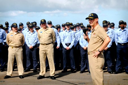 US Navy 090227-N-7280V-042 Rear Adm. Richard B. Landolt congratulates Sailors for earning the Battle Effectiveness Award