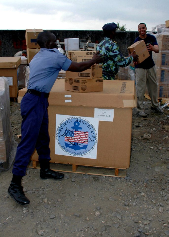 US Navy 090226-N-1655H-073 A Ghanaian, Cameroonian and U.S. Sailor load donated Project Handclasp materials for a community relations project
