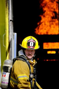 US Navy 090224-N-5345W-119 A firefighter surveys the scene of a simulated terrorist attack photo