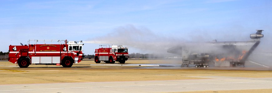 US Navy 090224-N-5345W-008 Emergency vehicles respond to a simulated aircraft crash and mass casualty drill photo