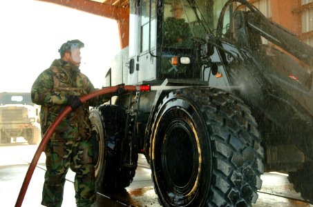 US Navy 090302-N-3674H-052 Steelworker 3rd Class Thaddeus Newton, assigned to Naval Mobile Construction Battalion (NMCB) 74, washes equipment during a mount out for a field exercise at Naval Construction Battalion Center Gulfpo