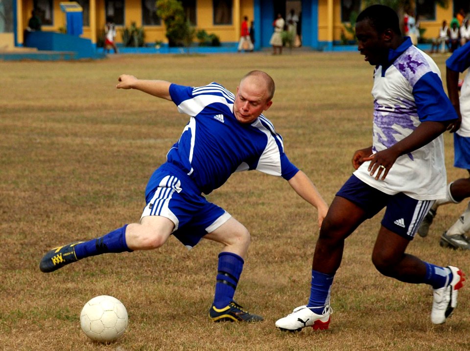 US Navy 090227-N-1655H-009 Boatswain's Mate 3rd Class Joseph Kluempers, assigned to the amphibious transport dock ship USS Nashville (LPD 13), left, makes a move on a Ghanaian Navy defender