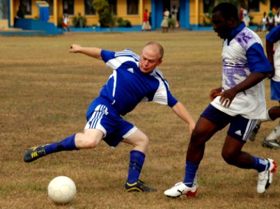 US Navy 090227-N-1655H-009 Boatswain's Mate 3rd Class Joseph Kluempers, assigned to the amphibious transport dock ship USS Nashville (LPD 13), left, makes a move on a Ghanaian Navy defender