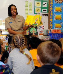 US Navy 090303-N-3666S-011 Boatswain's Mate 2nd Class Rasheema Newsome, assigned to Commander, Navy Region Hawaii, reads Dr. Seuss' The Cat in the Hat to kindergarten students at Lehua Elementary School