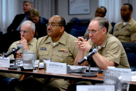 US Navy 090227-N-7676W-020 Rear Adm. Thomas R. Cullison and Vice Adm. Adam Robinson join Rear Adm. Nevin P. Carr Jr. for briefs photo