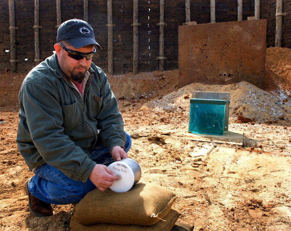 US Navy 090226-N-7090S-336 Joseph Rothenberger explains how improvised explosive devices (IEDs) are triggered