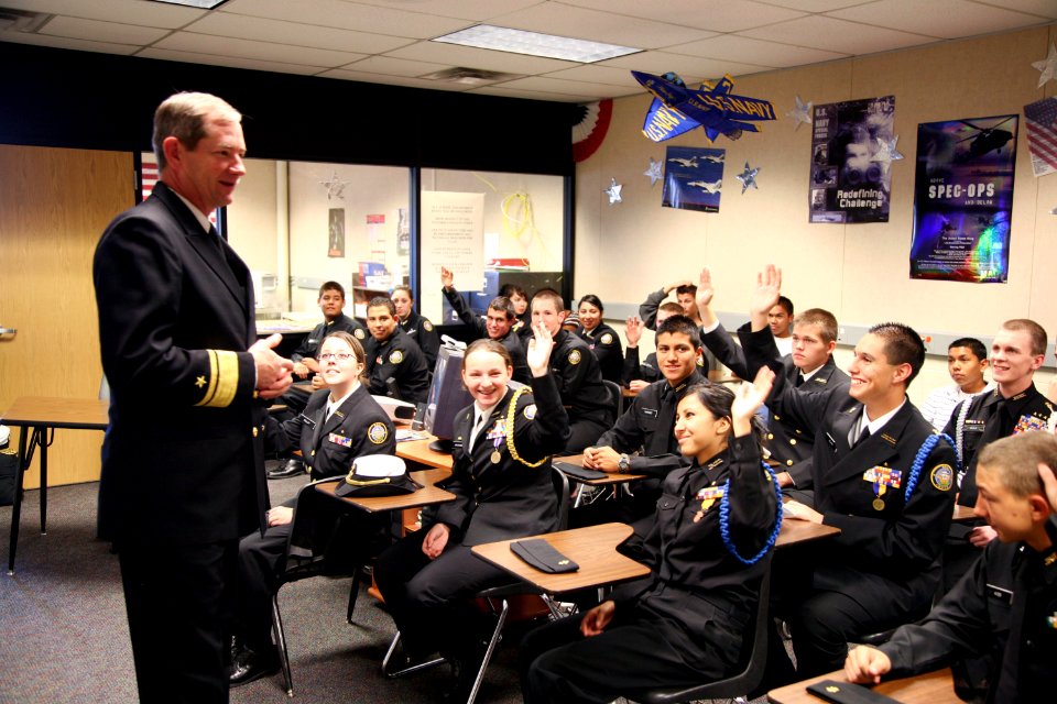 US Navy 090304-N-3271W-082 Rear Adm. Leendert R. Hering Sr., commander of Navy Region Southwest, visits with students from the Carl Hayden High School Navy Junior Reserve Officers Training Corps (JROTC) class