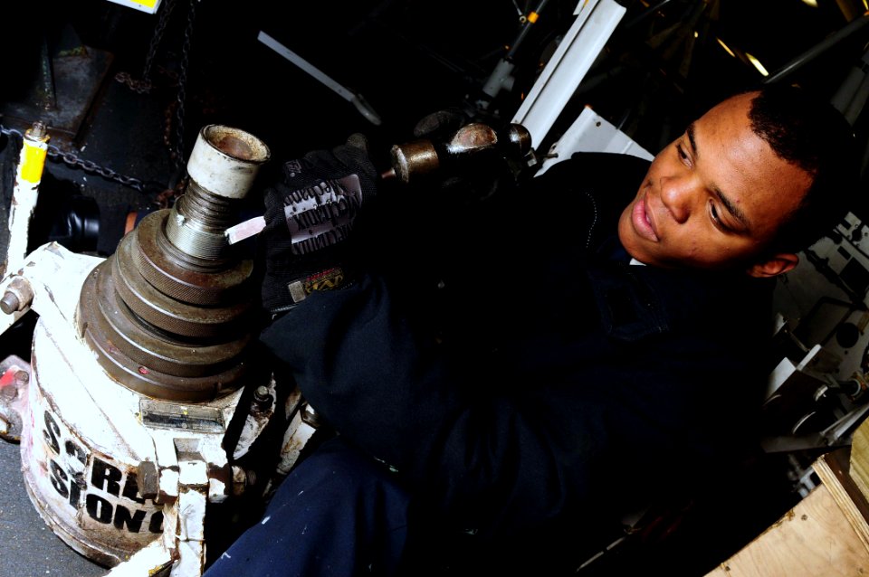 US Navy 090227-N-9760Z-013 Aviation Support Equipment Technician Airman William Brewer repairs a 12-ton jack