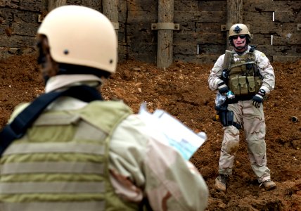 US Navy 090226-N-7090S-176 Lt. Andrew Scott and members of his explosive ordnance and disposal team perform post-blast analysis after the detonation of an improvised explosive device (IED)