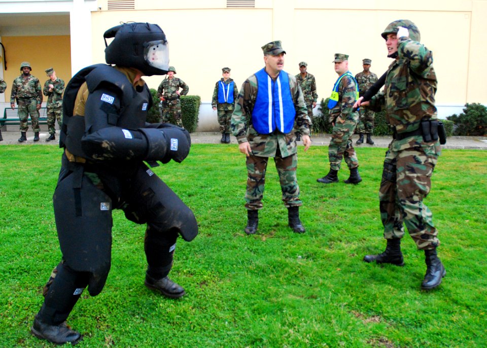 US Navy 090227-N-4044H-083 Master-at-Arms 3rd Class Matthew Wells prepares to perform tactical baton strikes during a team-building obstacle course at Naval Support Activity Naples