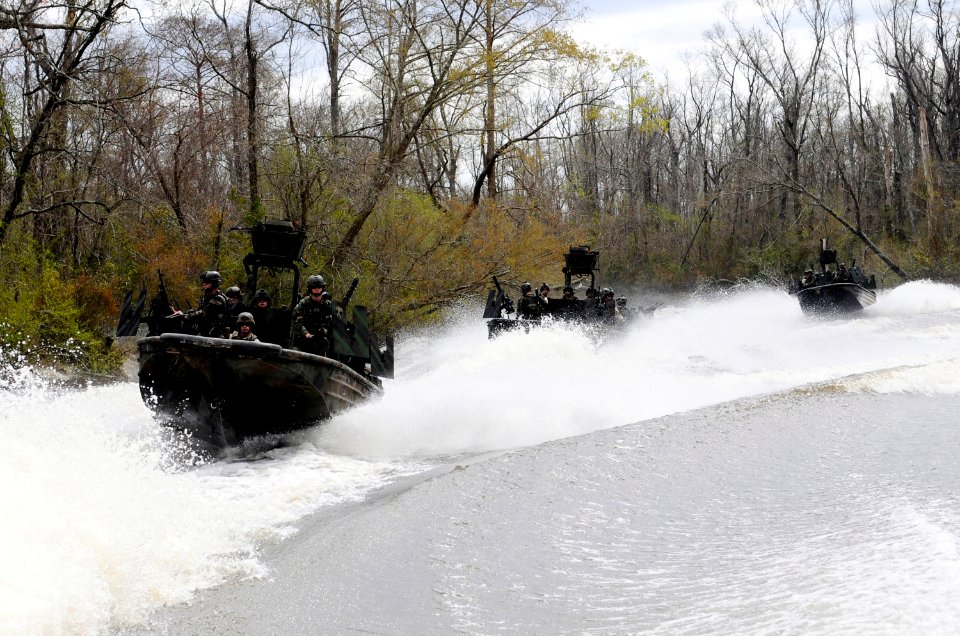 US Navy 090304-N-8933S-037 Special Warfare Combatant-craft Crewmen (SWCC) assigned to Special Boat Team (SBT) 22 conduct live-fire drills at the riverine training range at John C. Stennis Space Center