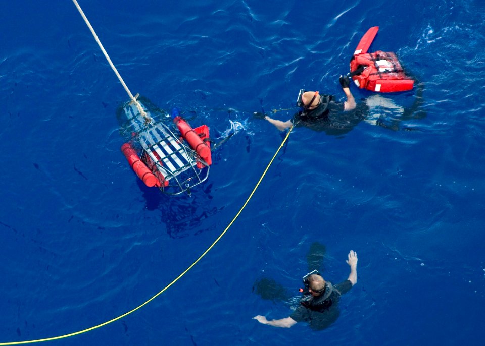 US Navy 090228-N-1251W-097 Search and rescue swimmer Aviation Electronics Technician 3rd Class Cody Robbins prepares to load Oscar onto a stretcher