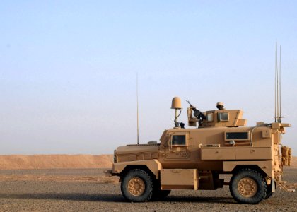 US Navy 090305-N-1120L-012 Seabees assigned to Naval Mobile Construction Battalion (NMCB) 7 man an M-240B crew served weapon while providing security at a forward operating base project site