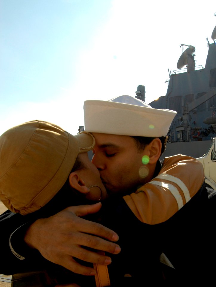 US Navy 090229-N-7544A-046 Gas Turbine System Technician Mechanical 2nd Class Ezekiel Lopez kisses his wife good-bye before leaving on a six-month deployment aboard the guided-missile destroyer USS Laboon (DDG 58)
