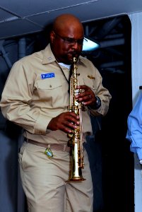 US Navy 090227-N-5215E-076 Lt. Russell Goff plays saxophone during the ship's Black History Month program